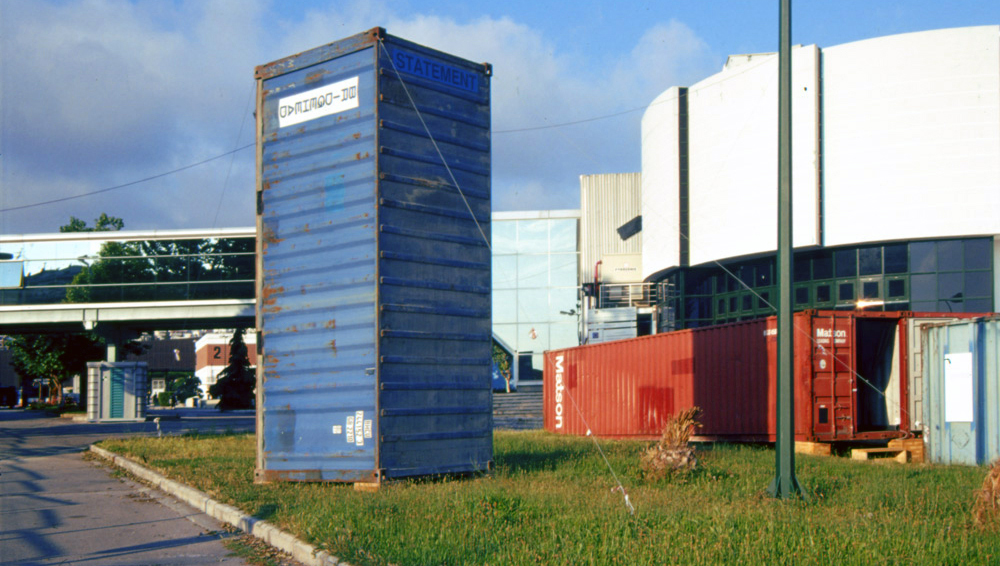 Art, artwork. A work entitled "Statement" by Nika Span / Nika Špan. Material: A metall container, Plexiglas with inscribing. Dimensions: appeox. 250 x 250 x 800 cm. Exhibition: Paths of Europe, Macedonian Museum of Contemporary Art, Thessaloniki, Greece.