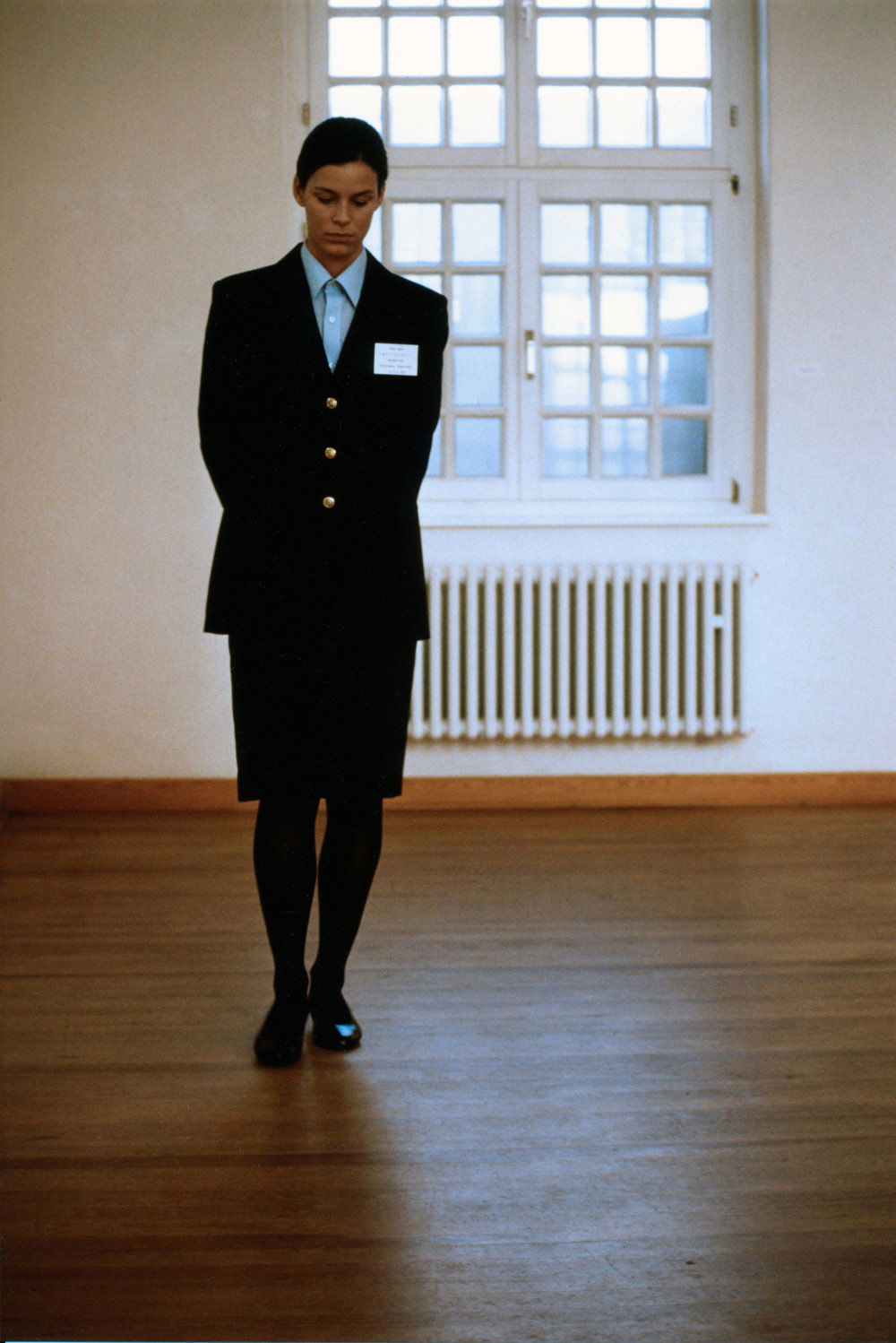 Art, artwork. A performance Ready-made entitled "Waiting Room" by Nika Span / Nika Špan. Material: A guard’s uniform with a label. Exhibition: Eller-Bahnhof 1, Eller Railway station, Duesseldorf, Germany.